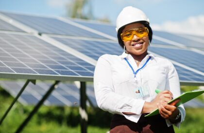 African american technician check the maintenance of the solar panels. Black woman engineer at solar station.